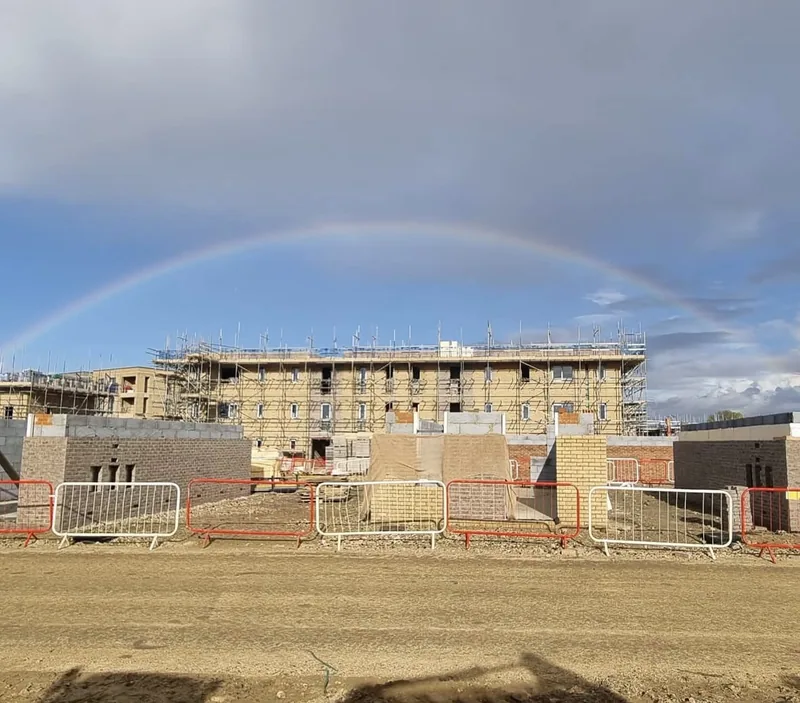 A new building going up behind site barriers